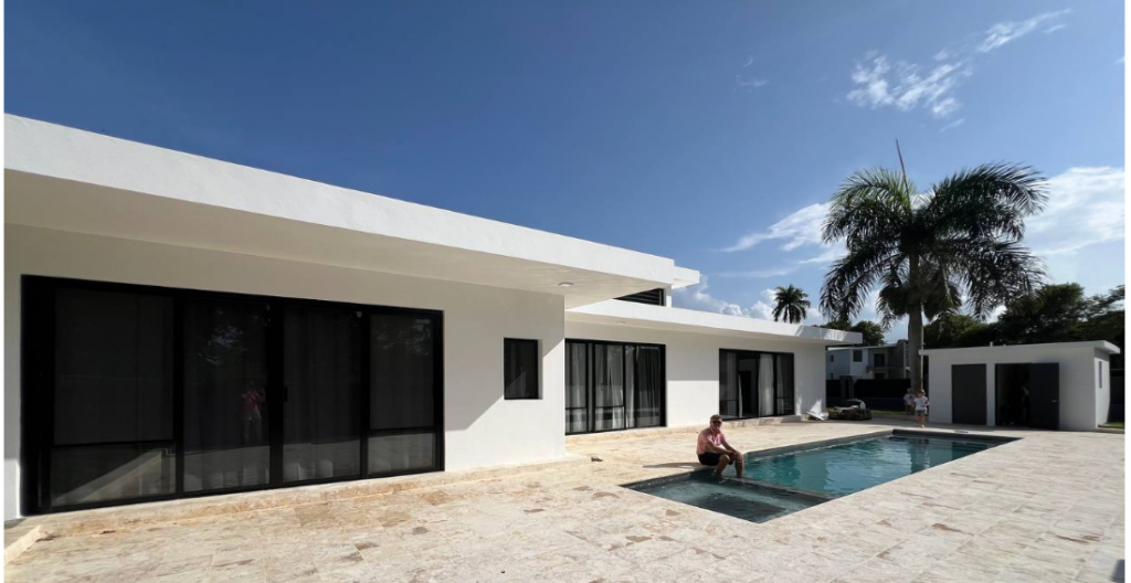 Fully furnished modern house for sale in Sosua, Dominican Republic, with pool, parking, and air conditioners.